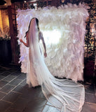 Handmade luxury white cloth back feather wall backdrop for weddings and events by Supply My Events